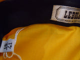 ferrari_f1_team_shirt_agip_yellow_w/black_on_front_of_shoulder_(030)-1_at_albaco.com